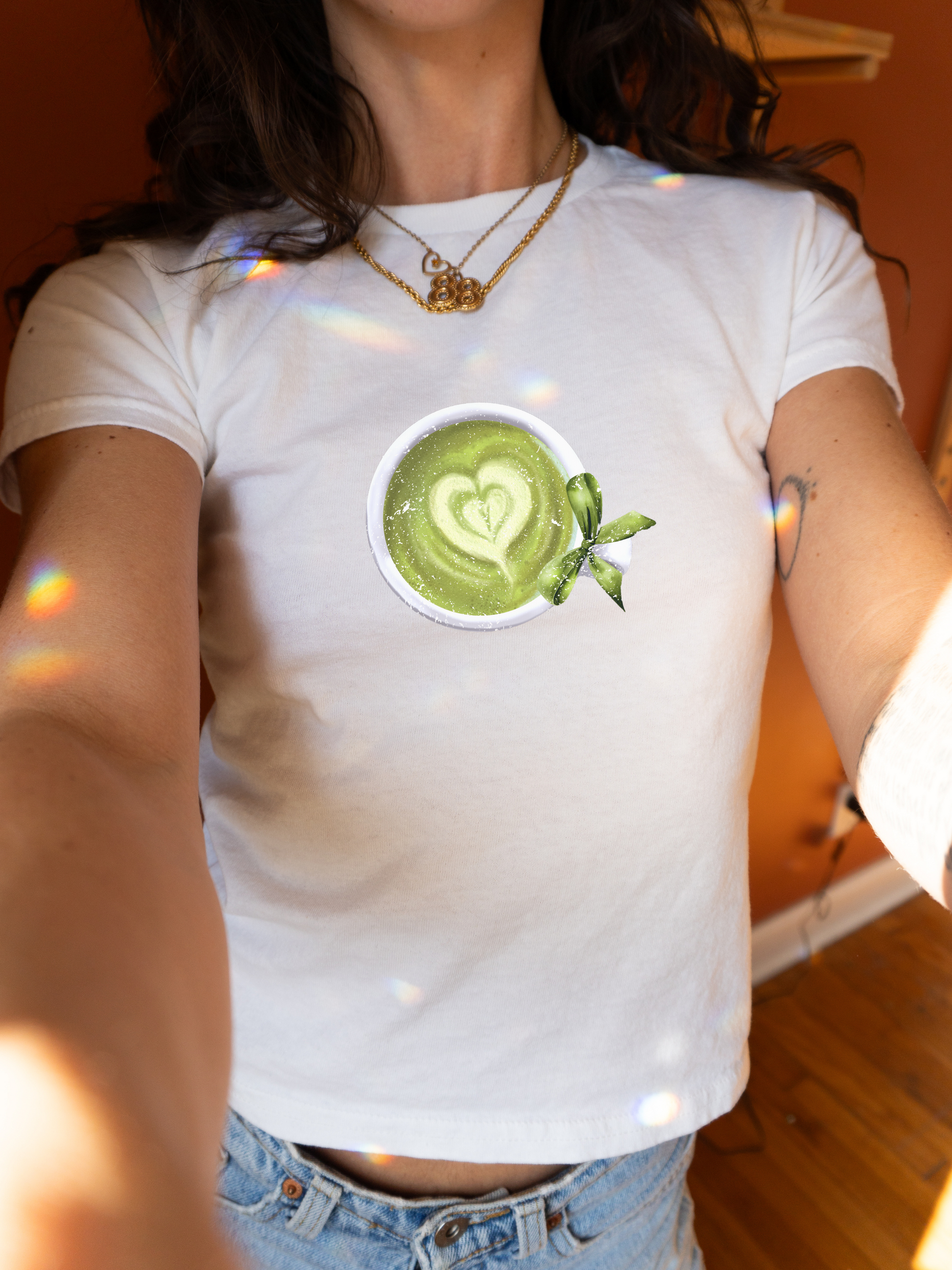 Women's Graphic Baby Tee featuring matcha tea with bow. Retro Aesthetic shirt. 