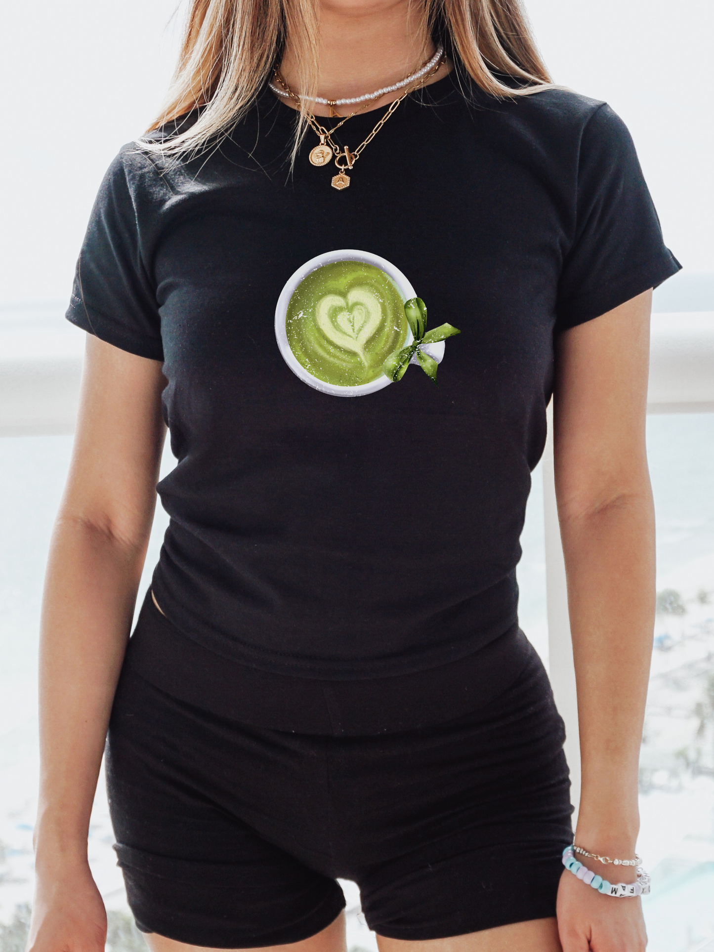 Women's Graphic Baby Tee featuring matcha tea with bow. Retro Aesthetic shirt. 