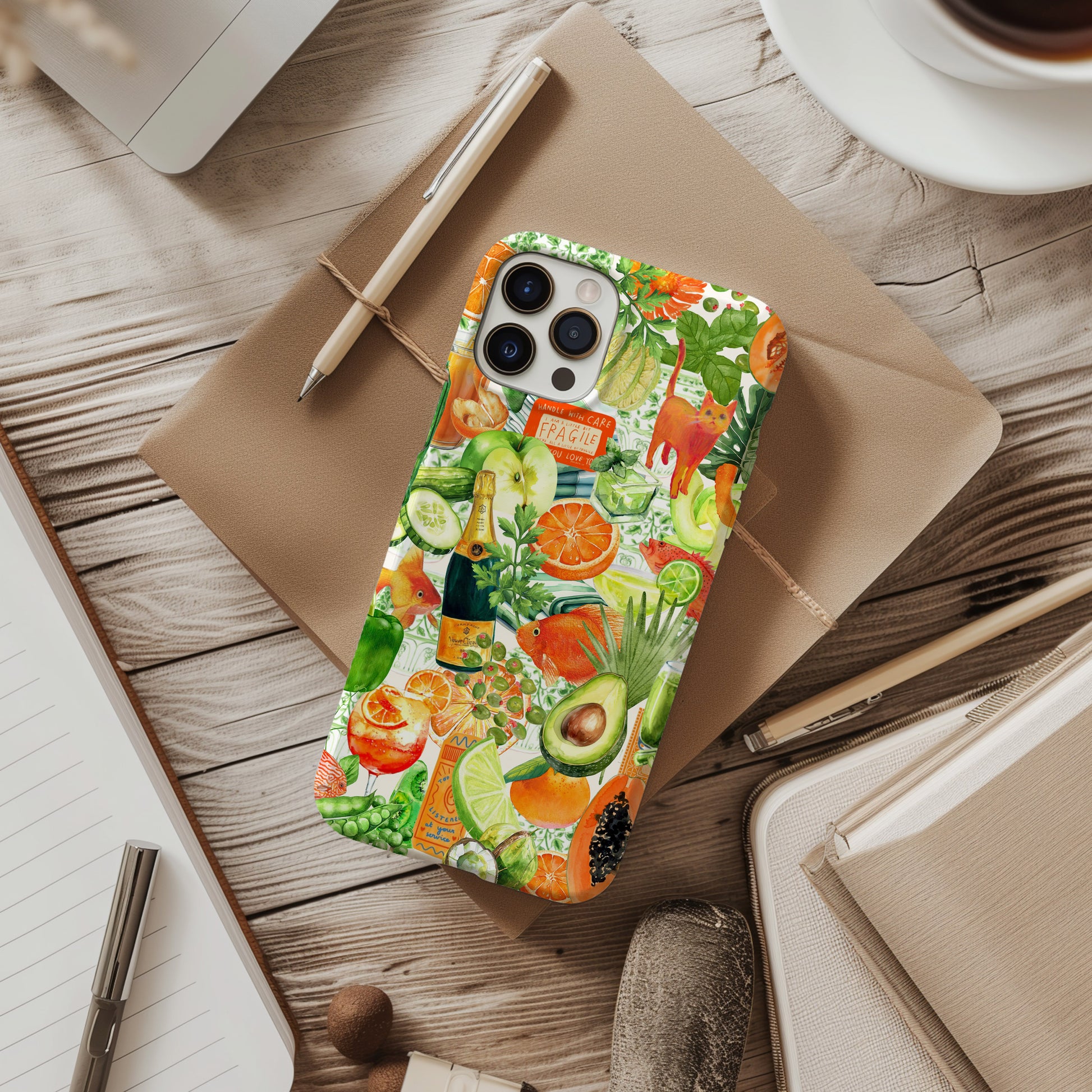 desk with Orange and Green Watercolor Collage Phone Case. Maximalist style collage phone case for iPhone and Samsung Galaxy phone. Summer phone case