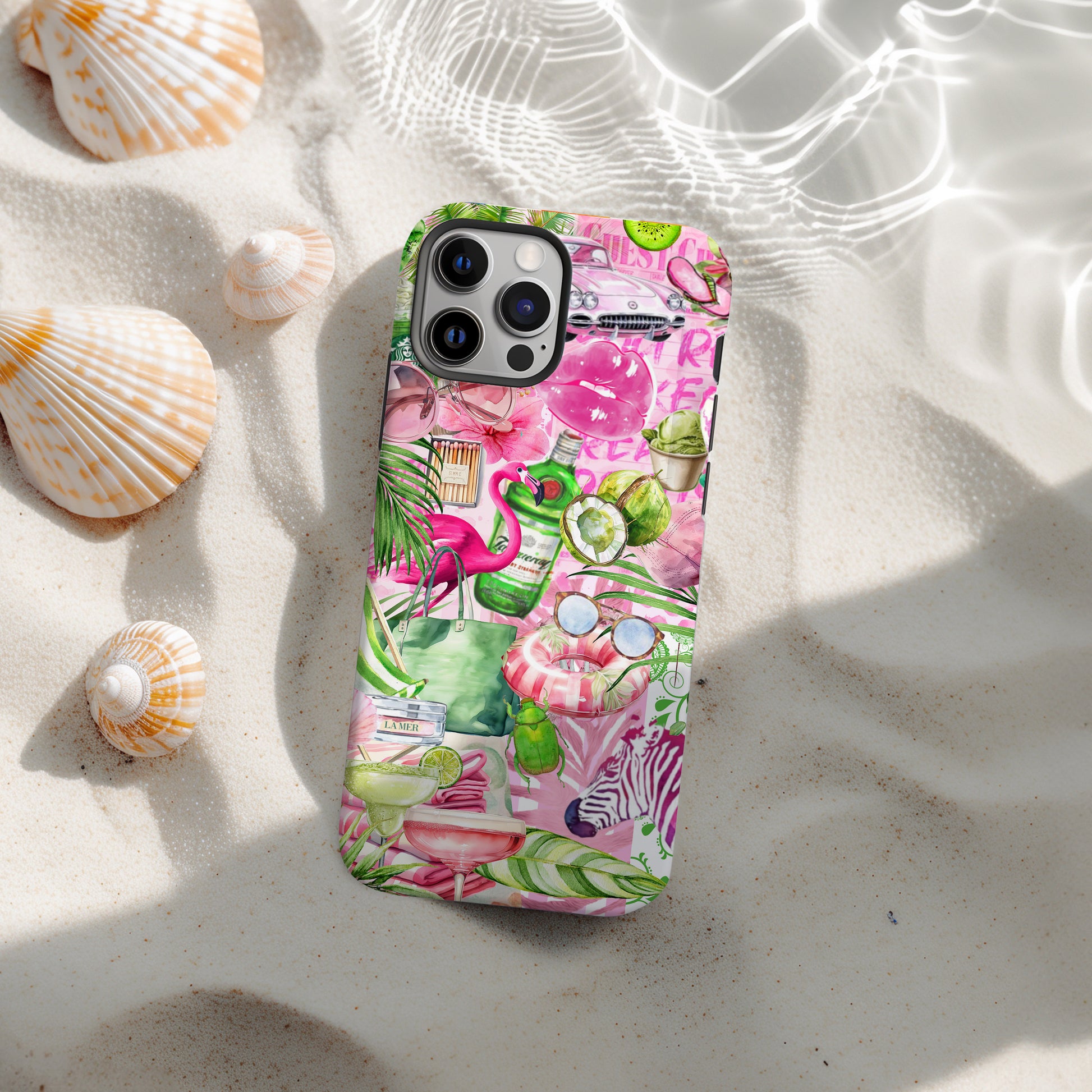 Palm Beach Collage Phone Case. Scrapbook style Maximalist preppy beach design. Pink and Green phone case for iPhone and Samsung Galaxy. Image shows phone case on the beach