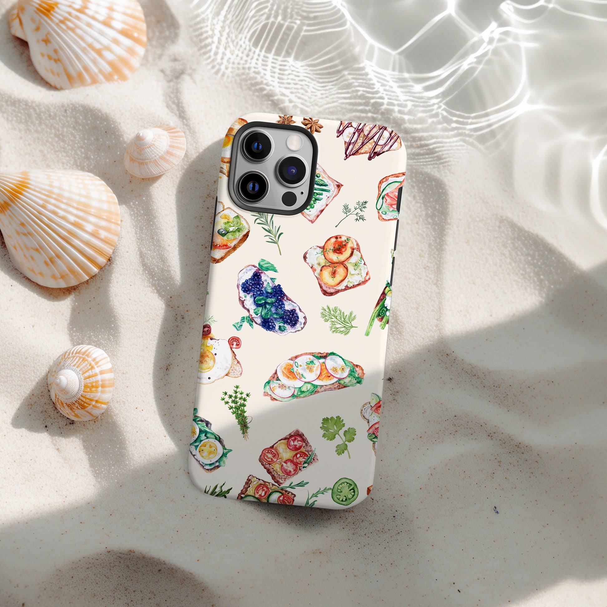 beach view of Sandwich Collage Phone Case is uniquely designed with delicate watercolor collage art. Available for both iPhone and Samsung Galaxy, this case artfully combines elements of open faced sandwiches with delicate herbs. Great foodie or chef gift by Artscape Market